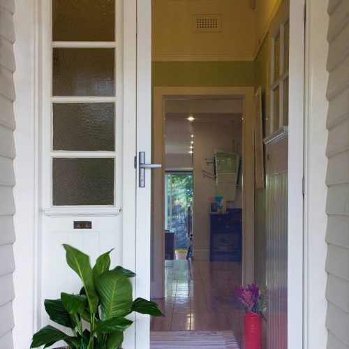 Amplimesh Supascreen security screen door, installed at the front entrance of a house.