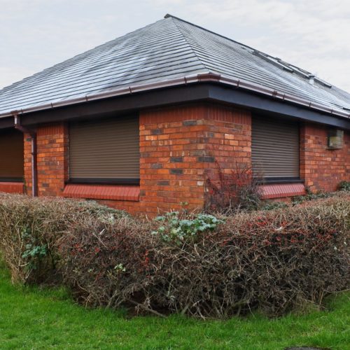 Brown security roller shutters installed in Perth home.