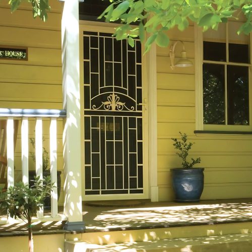 A heritage home with a matching security door.