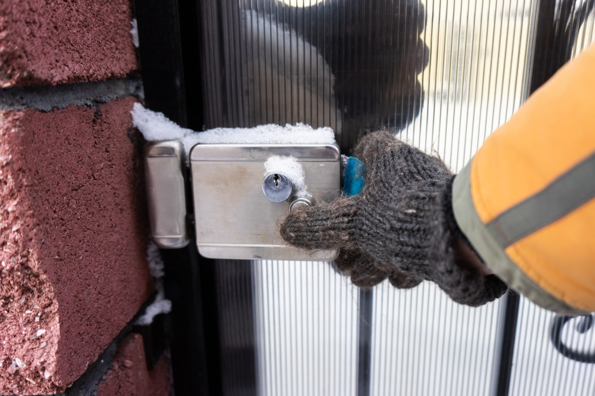 Entrance Door Lock Problems: 7 Quick Fixes To Keep Your Home Safe and Secure 3 Front entrance with a frozen lock covered in snow.