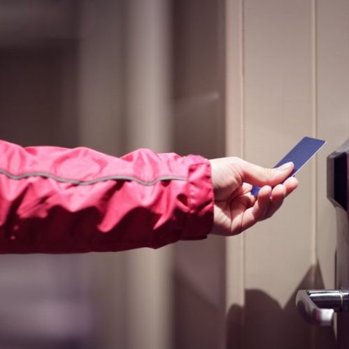 Man using keyless door lock because of the benefits.