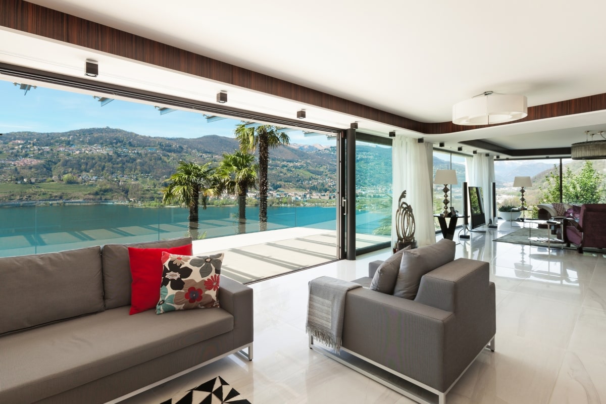 Elegant interior design complemented by floor-to-ceiling patio screens, seamlessly connecting the indoors to the picturesque outdoors.