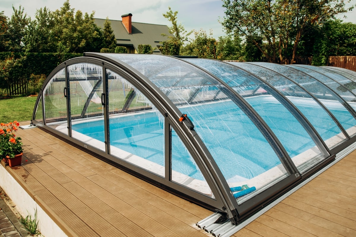 Retractable pool enclosures are a great way to enjoy a dip in summer or winter.