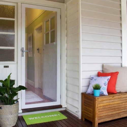 Image illustrates difference between a safety screen door and a compliant security door.