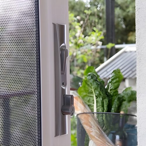 Close up of triple lock on stacked doors.