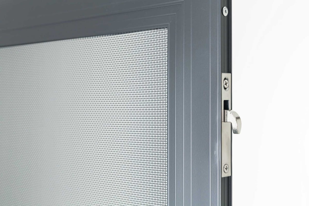 Safety Screen Door or Security Door? Don’t Risk the Wrong Choice 2 Close-up of a grey mesh security screen door and locking mechanism.