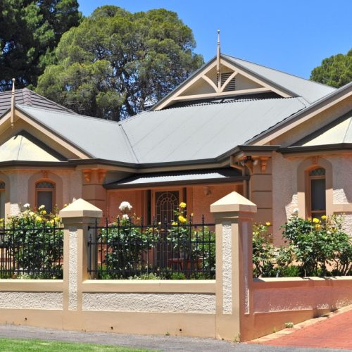 Exterior Australian traditional style home, with heritage screen doors that add charm and character.